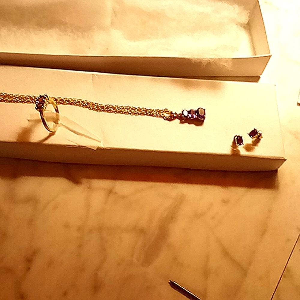Necklace, ring, (size 8) and earrings.